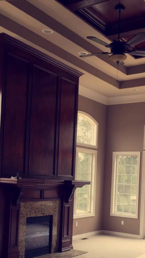 Painted crown molding, window trim and stained cabinetry