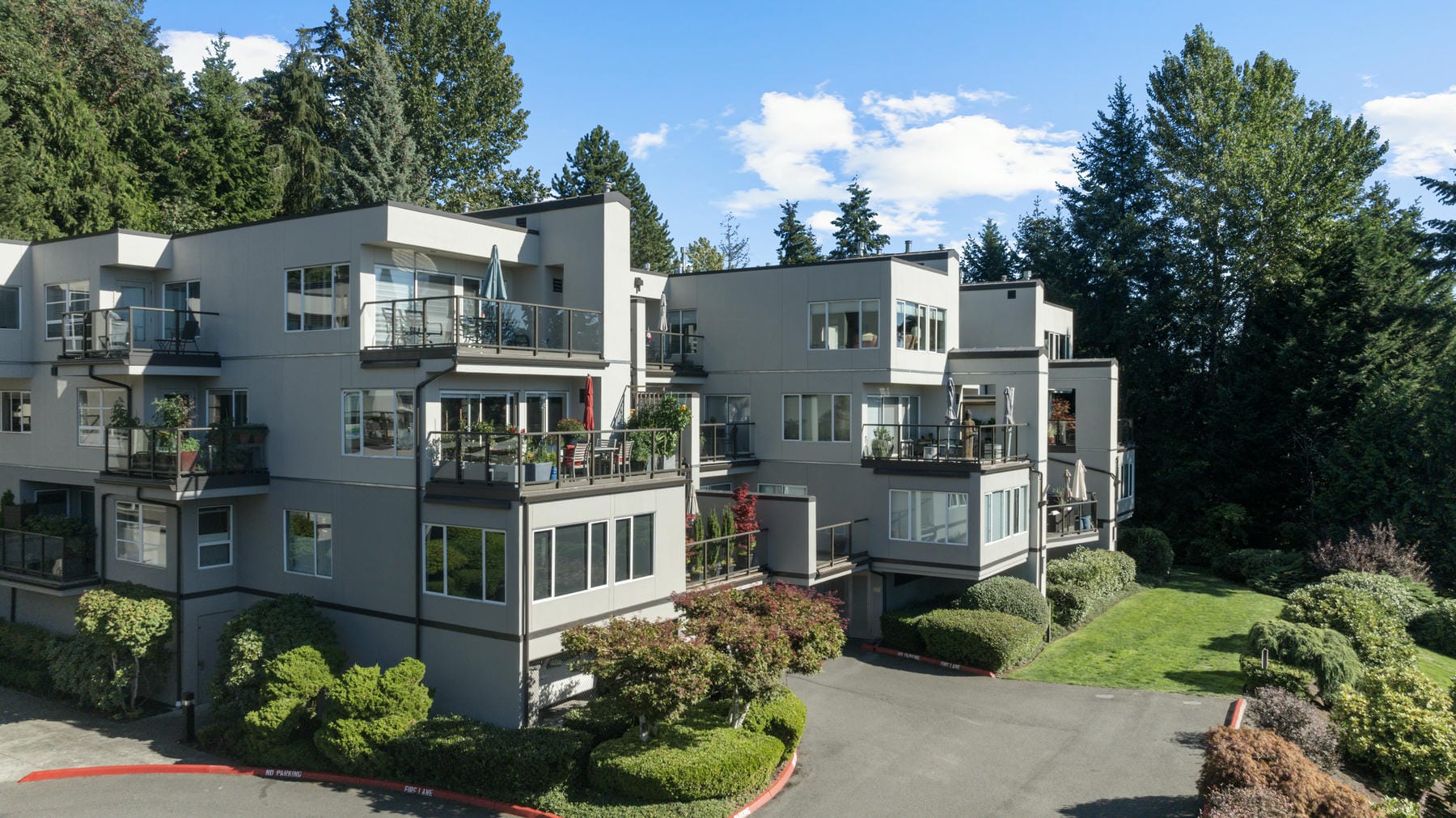 Exterior of a multi-story multifamily building before repainting