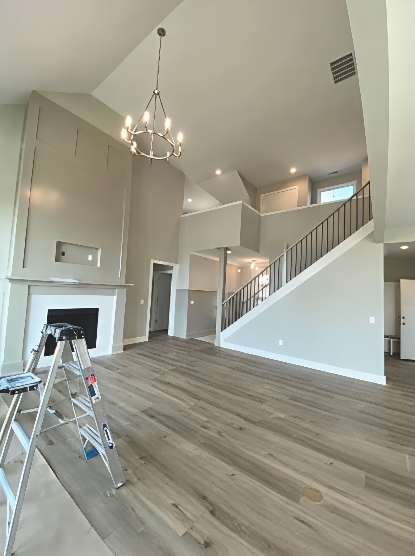 Two-story great room and staircase during interior painting